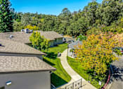 Thumbnail 12 of 13 - A residential area with houses and trees.