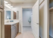 Thumbnail 26 of 28 - A kitchen with a white door leading to a hallway.