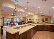 Thumbnail 6 of 39 - Clubhouse with Graceful Kitchen Area at Sky Court Harbors at The Lakes Apartments, Las Vegas, NV, 89117