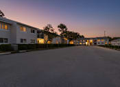 Thumbnail 4 of 31 - A street view of a residential area with buildings on both sides and a clear sky.