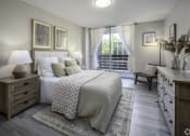 Thumbnail 3 of 23 - a bedroom with a bed and a window