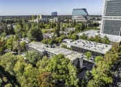 Thumbnail 22 of 23 - an aerial view of a city with trees and buildings