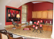Thumbnail 9 of 17 - Interior Unit Breakfast Bar Kitchen at Villa Valencia Apartments, Orlando, FL