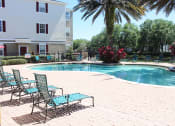 Thumbnail 16 of 17 - Pool Lounge Chairs at Villa Valencia Apartments, Florida