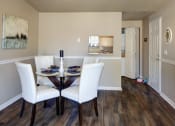 Thumbnail 22 of 34 - a dining room with a table and chairs at 2000 Lake Washington Apartments, Washington, 98056