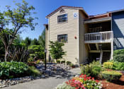 Thumbnail 1 of 34 - a house with a garden in front of it at 2000 Lake Washington Apartments, Renton, WA, 98056