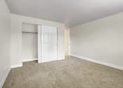 Thumbnail 5 of 34 - an empty room with carpet and a closet at 2000 Lake Washington Apartments, Washington, 98056