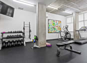 Thumbnail 36 of 46 - Free Weights in the Fitness Center at The Parker Apartments, Portland, OR
