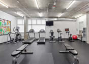 Thumbnail 38 of 46 - Plenty of Cardio Equipment in the Fitness Center at The Parker Apartments, Portland, OR, 97209