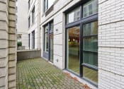 Thumbnail 30 of 46 - the front door of the house is open to the patio at The Parker Apartments, Portland, Oregon