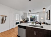Thumbnail 4 of 46 - Open Concept Kitchen and Living Room at The Parker Apartments in Portland, OR 97209