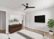 Thumbnail 6 of 31 - a living room with a ceiling fan and a bed