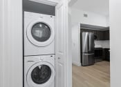 Thumbnail 30 of 56 - a front loading washer and dryer in a laundry room at One Plantation in FL 33324