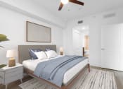Thumbnail 22 of 56 - a bedroom with a large bed and a ceiling fan at One Plantation in Florida 33324