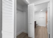Thumbnail 24 of 56 - a small bathroom with a white closet and a toilet at One Plantation in Plantation, Florida 33324