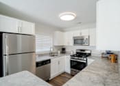 Thumbnail 3 of 27 - Modern Kitchen at The Residences at Stevens Pond in Saugus, MA 01906