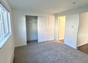 Thumbnail 15 of 34 - A room with white walls and a grey carpet at 2000 Lake Washington Apartments, Renton, 98056