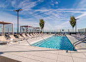 Thumbnail 11 of 41 - Resort Style Outdoor Pool at 903 Peachtree Apartments in Atlanta, GA 30309