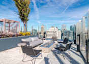 Thumbnail 13 of 41 - Poolside Outdoor Patio at 903 Peachtree Apartments in Atlanta, GA 30309