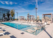 Thumbnail 12 of 41 - Resort Style Outdoor Pool at 903 Peachtree Apartments in Atlanta, GA 30309