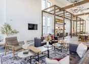 Thumbnail 22 of 31 - Market-Style Community Lounge at The Merchant Apartments in Charleston, SC 29403