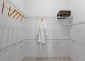 Thumbnail 26 of 42 - A white bathroom with a towel hanging on a rack.