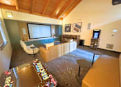Thumbnail 28 of 30 - A room with a brown carpet and a wooden ceiling at The Lakes in Bellevue, Washington