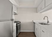 Thumbnail 7 of 33 - Kitchen with Stainless Steel Appliances at Chevy Chase in TX 78752