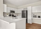 Thumbnail 4 of 29 - commons apartment kitchen with stainless steel appliances at Veranda at Centerfield in Houston, TX 77070