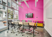 Thumbnail 30 of 43 - a conference room with a pink wall and a table with chairs at L Seven, San Francisco, California 94103