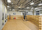Thumbnail 37 of 43 - a gym with a row of benches and weights on the wall at L Seven, California, 94103