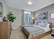 Thumbnail 17 of 43 - a bedroom with a bed and a dresser and a window at L Seven, San Francisco, 94103