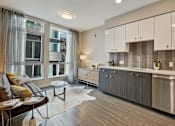 Thumbnail 8 of 43 - a kitchen and living room in an apartment at L Seven, CA 94103