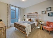 Thumbnail 4 of 43 - a bedroom with a bed and a window at L Seven, San Francisco, CA