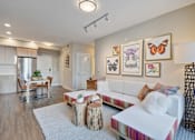 Thumbnail 3 of 43 - a living room with a white couch and a kitchen with a table at L Seven, California, 94103