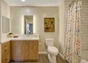 Thumbnail 7 of 43 - a bathroom with a toilet and a sink and a shower curtain at L Seven, San Francisco, CA