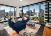 Thumbnail 4 of 44 - Living room area with view and couch at 903 Peachtree, Atlanta, GA