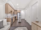 Thumbnail 7 of 44 - Living with open kitchen at 903 Peachtree, Atlanta, 30309