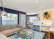 Thumbnail 28 of 28 - a living room with a couch and a glass coffee table at Residences at Stevens Pond, MA 01906