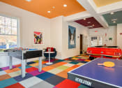 Thumbnail 8 of 28 - a games room with a pool table and ping pong at Residences at Stevens Pond, Saugus, Massachusetts 01906