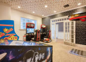 Thumbnail 6 of 28 - the game room has a lot of video games at Residences at Stevens Pond, Saugus, MA
