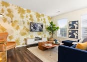 Thumbnail 16 of 28 - a living room with a couch and a coffee table at Residences at Stevens Pond, Saugus, MA