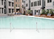 Thumbnail 15 of 39 - swimming pool in front of apartments at The Merchant Apartments, South Carolina