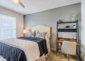 Thumbnail 5 of 39 - a bedroom with a bed and a nightstand at The Merchant Apartments, South Carolina