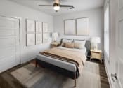 Thumbnail 12 of 39 - bedroom with a bed and a ceiling fan at The Merchant Apartments, Charleston