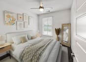 Thumbnail 13 of 39 - a bedroom with a bed and a ceiling fan at The Merchant Apartments, Charleston, South Carolina