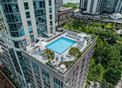 Thumbnail 56 of 57 - an aerial view of a pool on top of a tall building at Shoreham and Tides, Chicago, IL