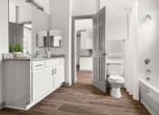 Thumbnail 16 of 40 - a white bathroom with a toilet and a sink at Aston at Cinco Ranch, Katy, 77450