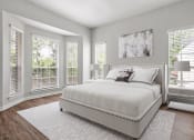 Thumbnail 21 of 40 - a bedroom with a large bed and windows at Aston at Cinco Ranch, Katy, Texas