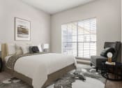 Thumbnail 8 of 40 - a bedroom with a large bed and a large window